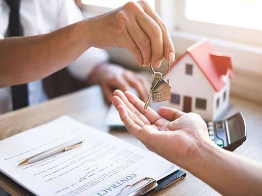 Handing over house keys at a property signing