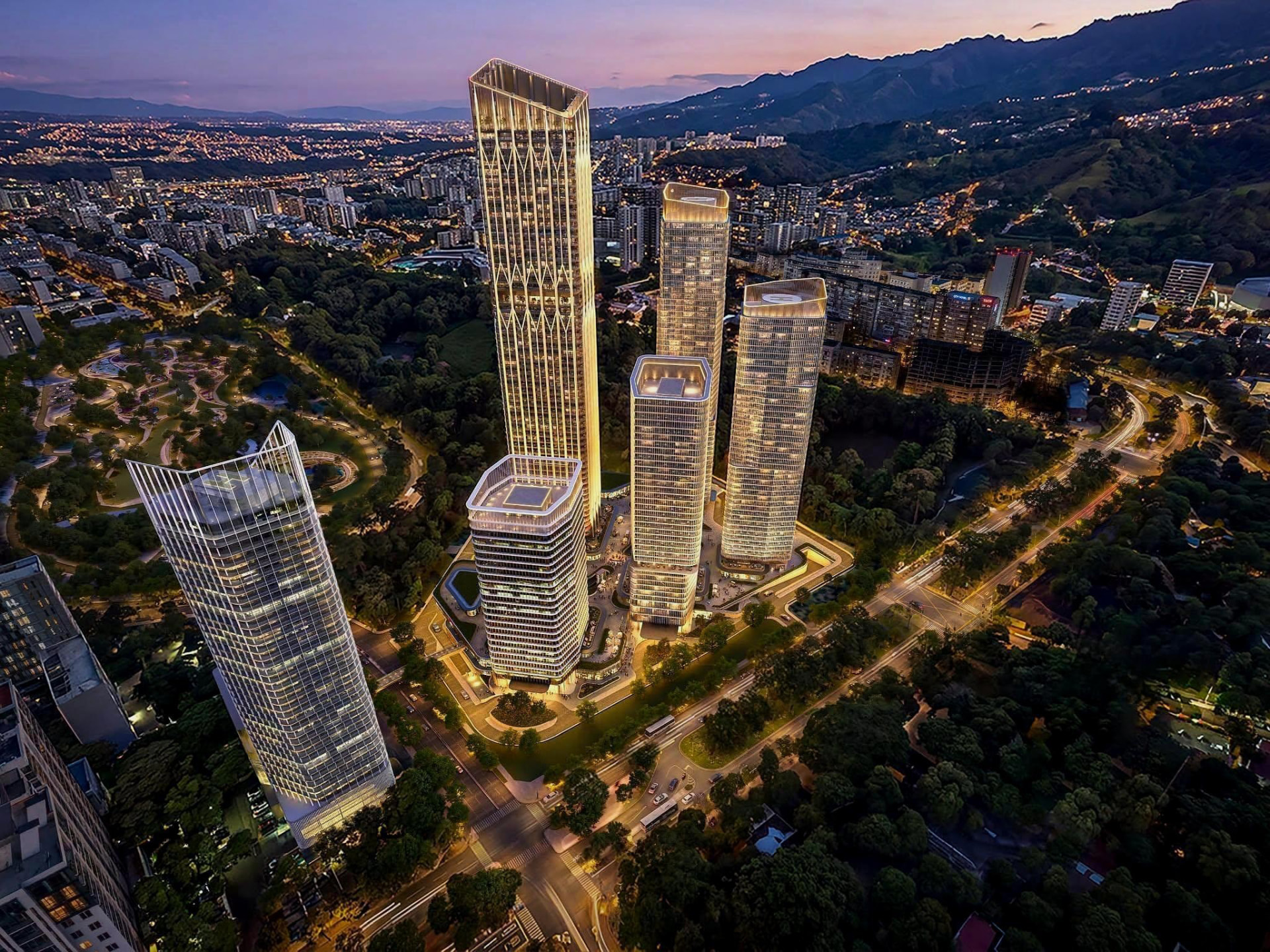 Illuminated modern glass towers at dusk in a new city development
