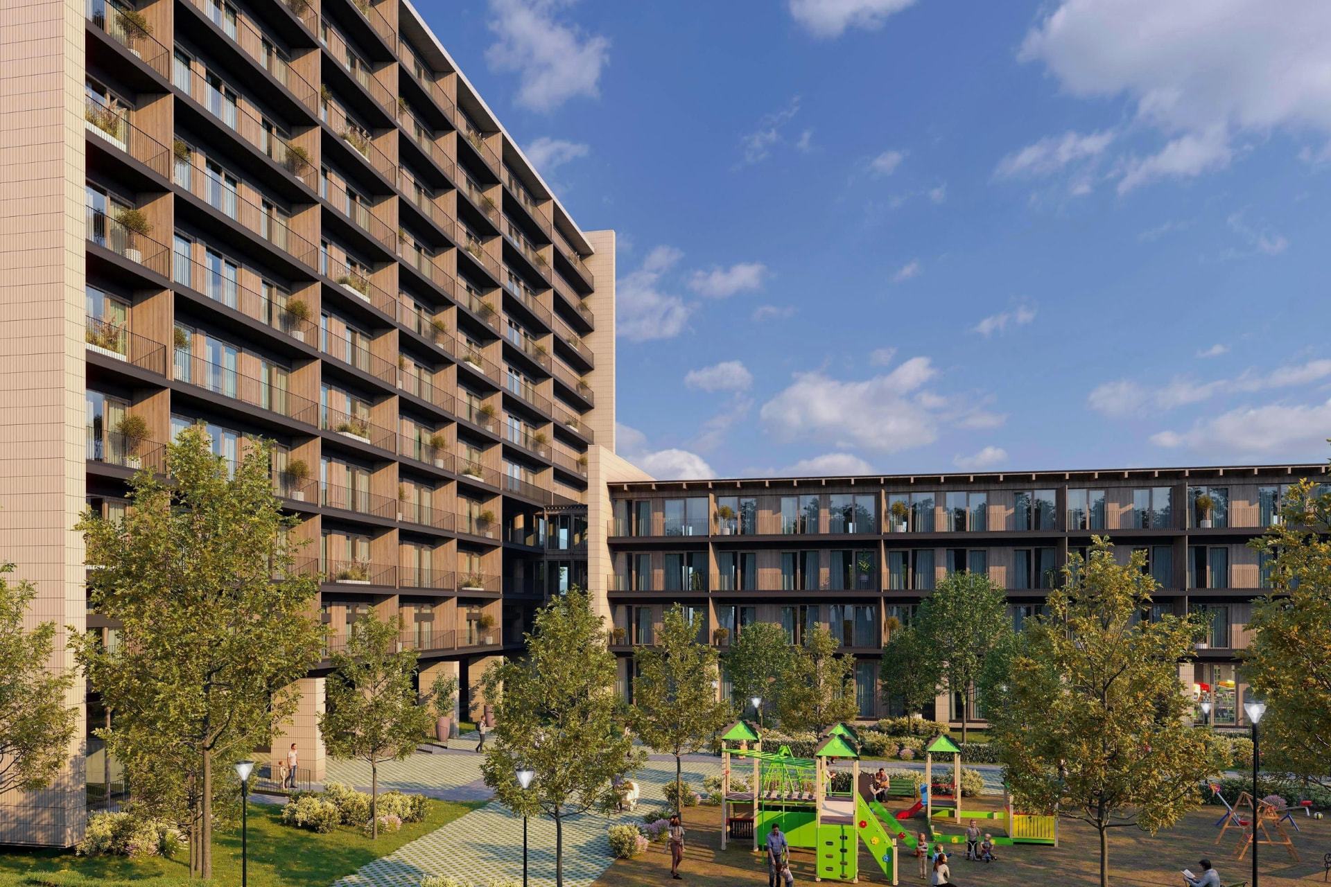 Modern residential complex with a green courtyard and playground